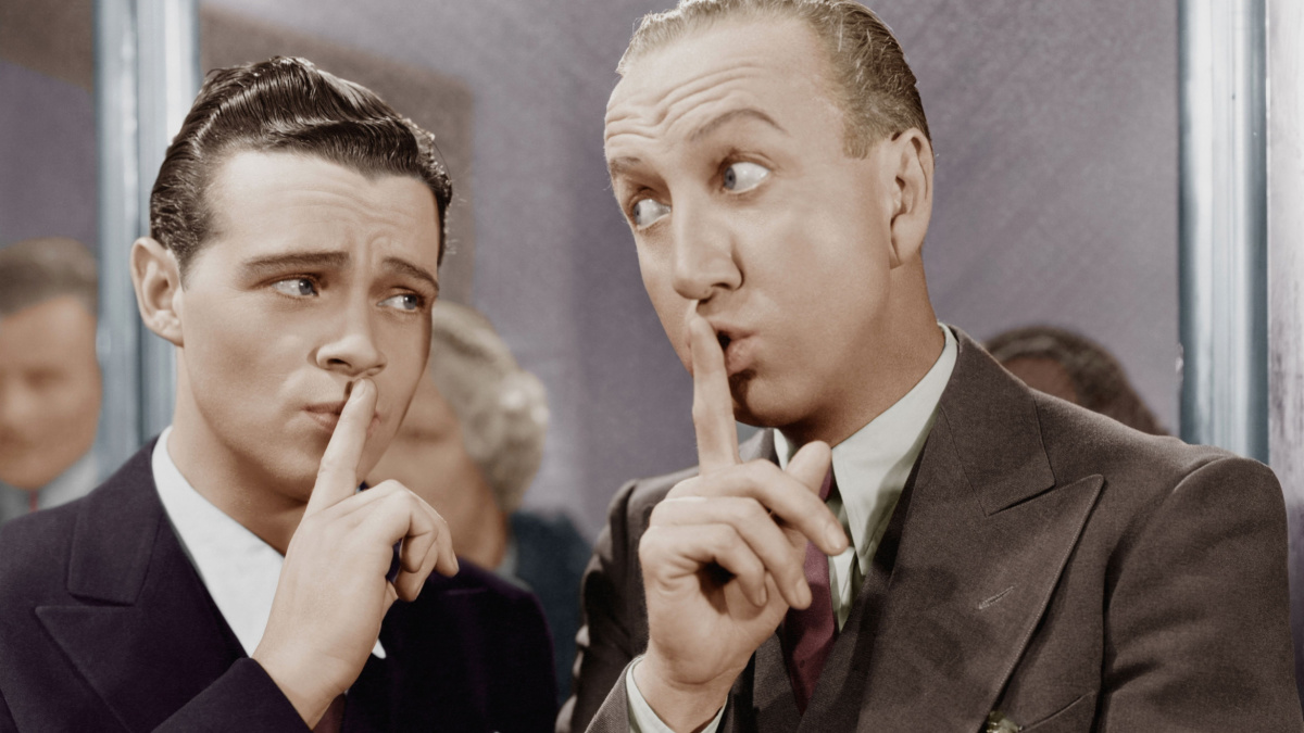 DISCRETION. two men keeping secret.