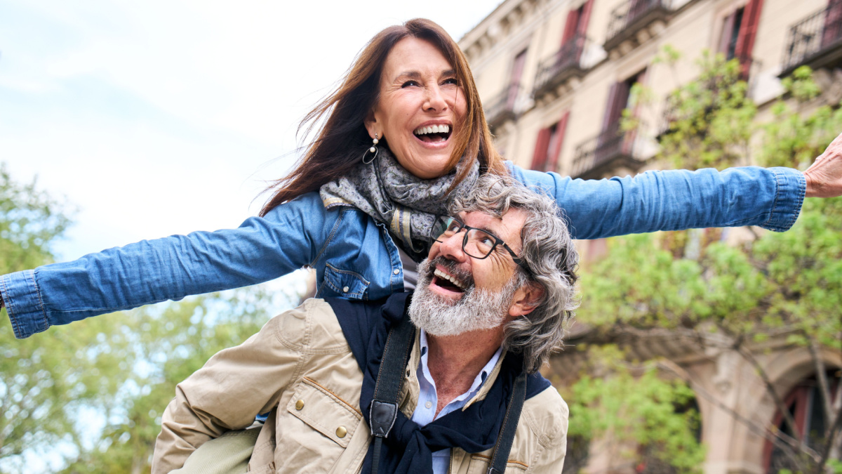 Smiling elderly couple having fun together on vacation.