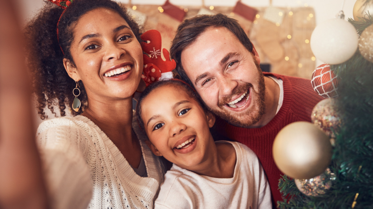 Christmas, happy family and portrait, selfie and funny together in home.