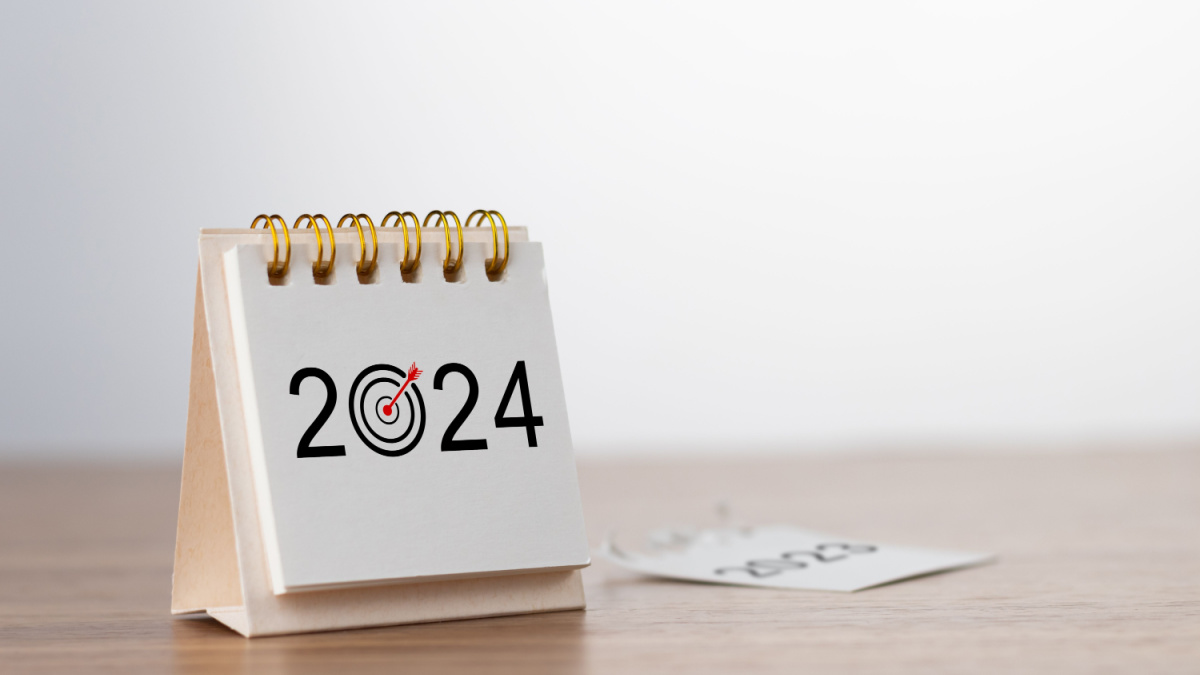2024 Happy New year background. Turns over a calendar sheet. Setup objective target business cost and budget planning of new year concept. year change from 2023 to 2024.