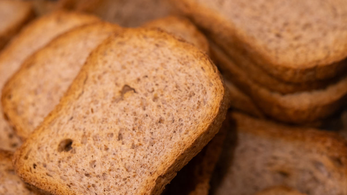 A closeup portrait of a pile of multiple delicious crispy tasty rusk, sea biscuit or hardtack biscuits, ideal food for a lunch, brunch or quick snack with jam or jelly or chocolate spread.