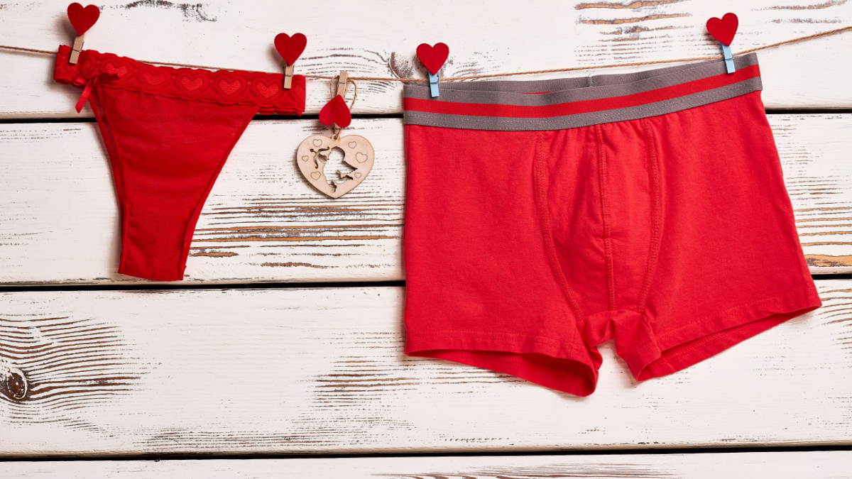 Red panties and boxer briefs. Underwear on rope with clothespins. Red color as love symbol.