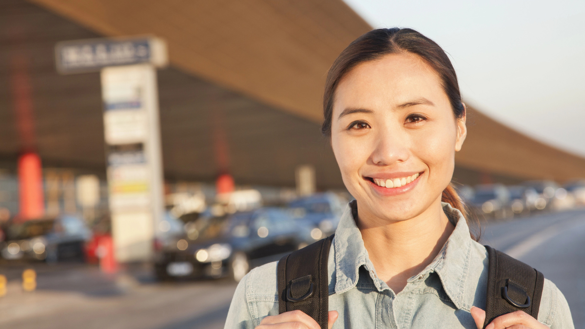 Traveler portrait outside of airport.