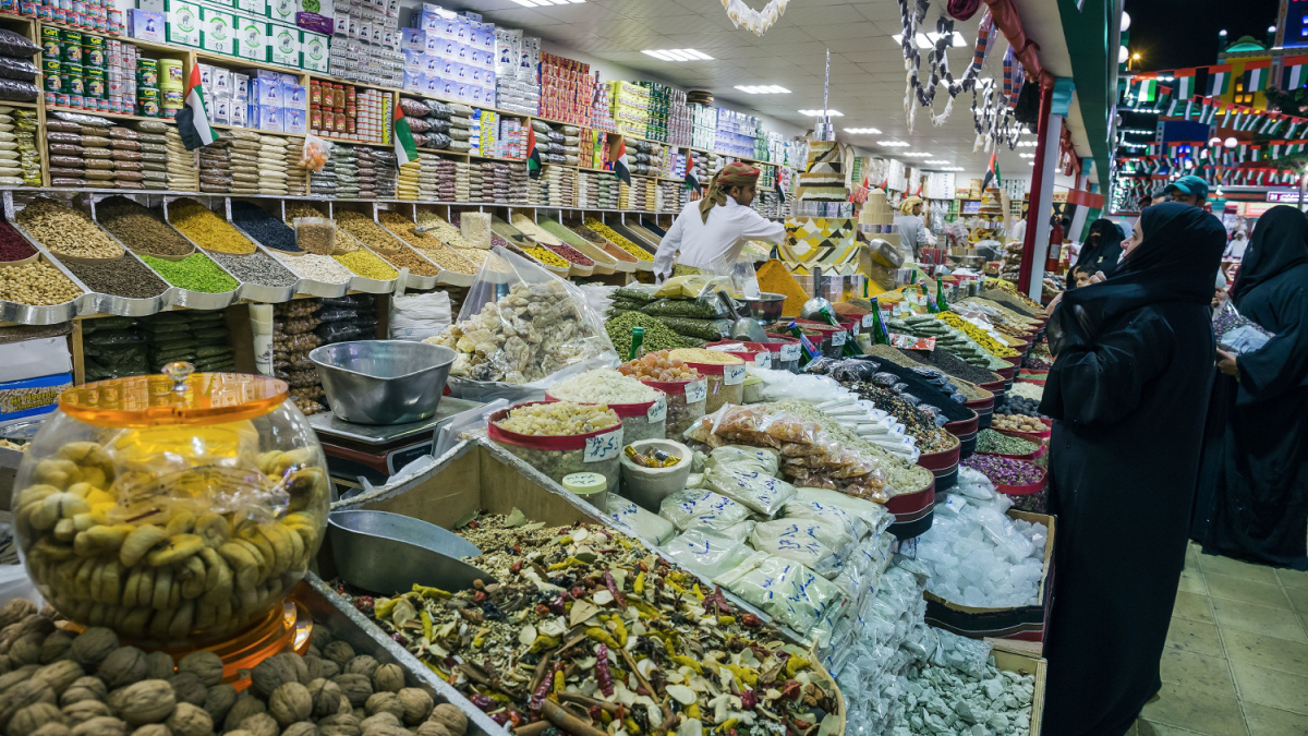 DUBAI, UAE - DECEMBER 4, 2017: Seller of of spices in the park entertainment center Global Village.