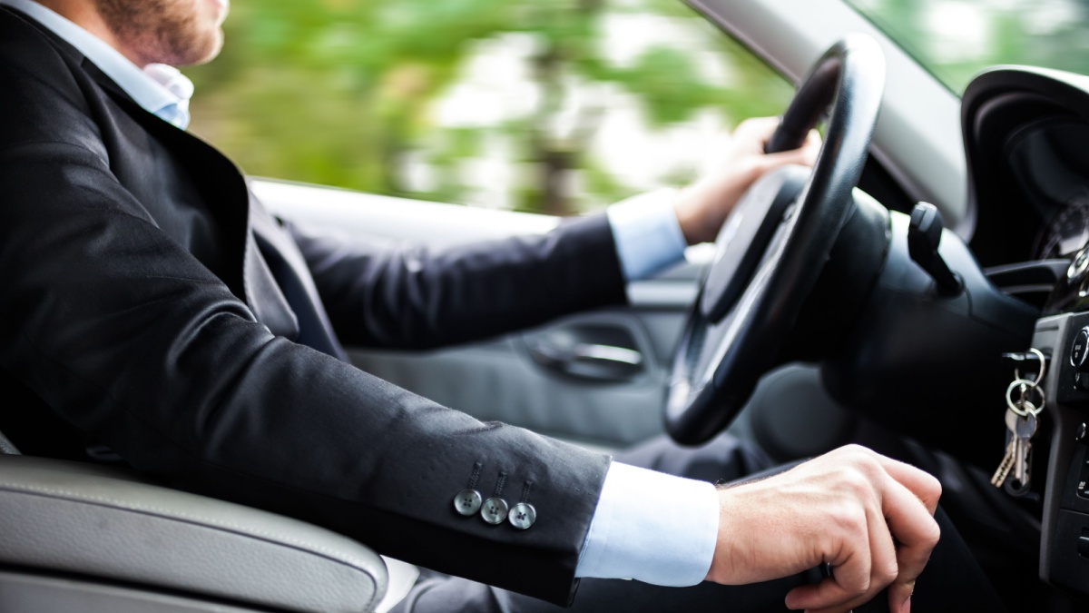 Man driving his car.