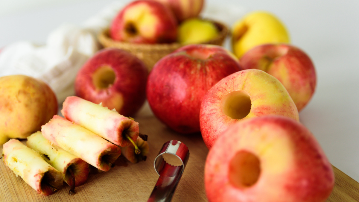 Fresh apples without core. Removed with corer tool. Ingredient for jam or pie. Harvest