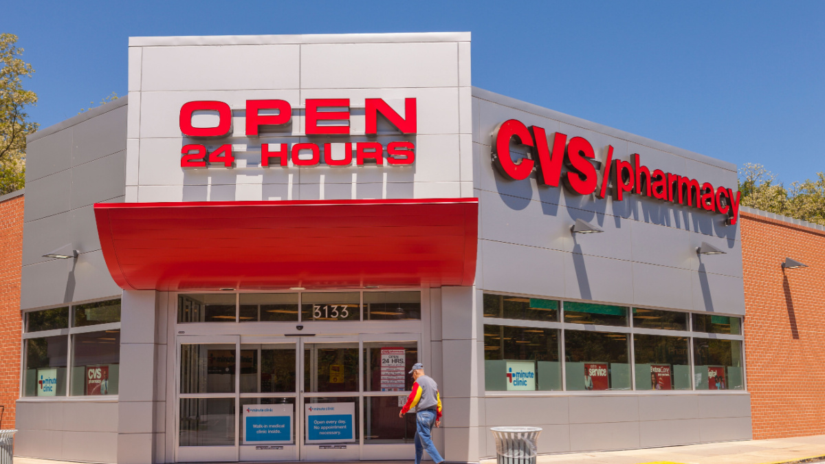 CVS pharmacy store entrance, with signs Open 24 hours.