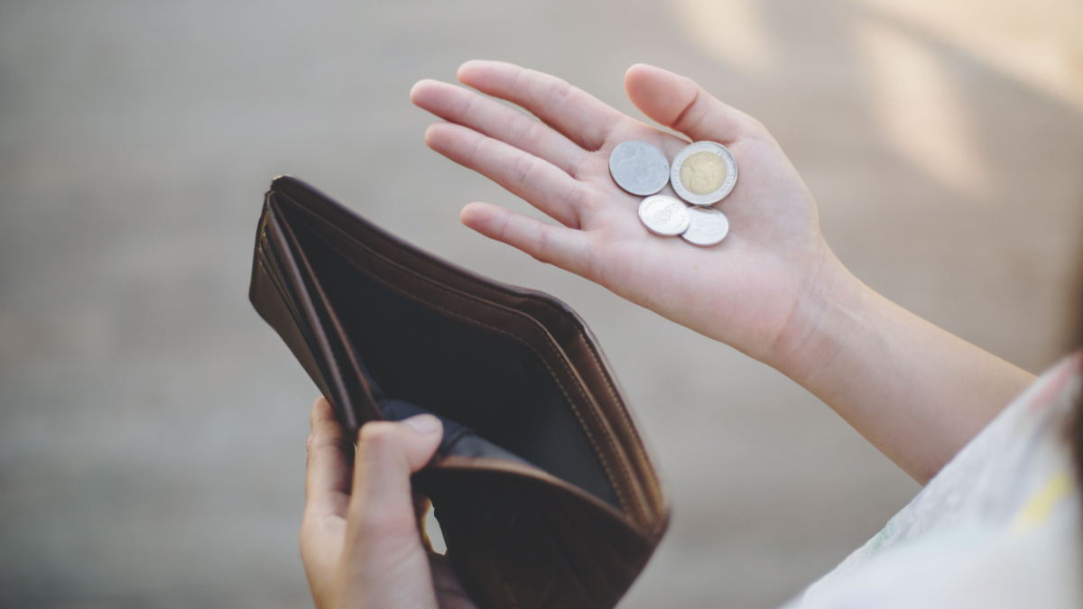 businesswoman on have money unemployed and bankrupt looks into his empty wallet. Stress crisis, unemployed businessmen are waiting for new jobs, recession situation and hopelessness crisis concept.