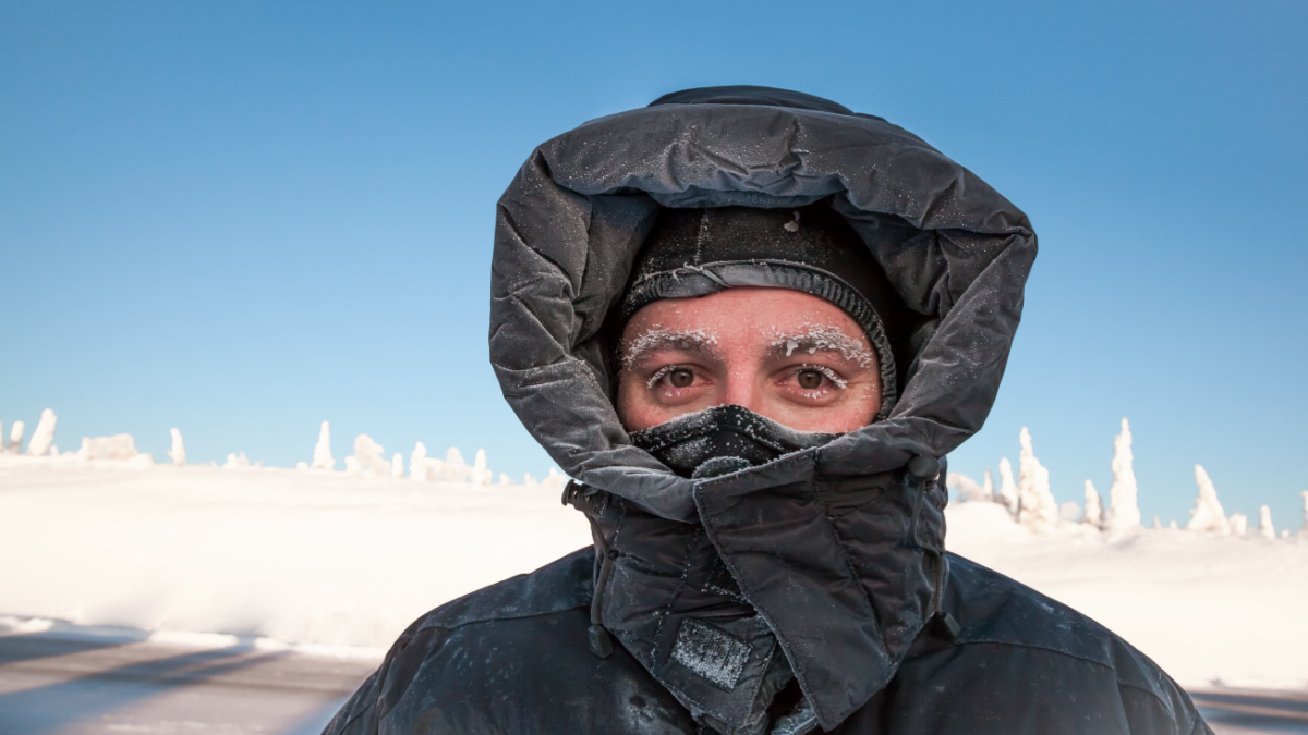 Man bundled in winter coat in Alaska.
