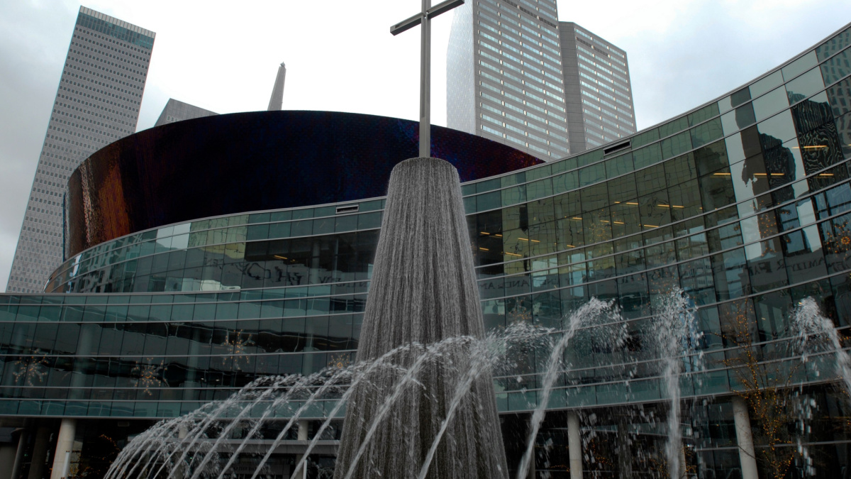The modern glass facade of First Baptist Dallas, a megachurch located in downtown Dallas, Texas. The church was established in 1868; the new worship center opened in 2013.
