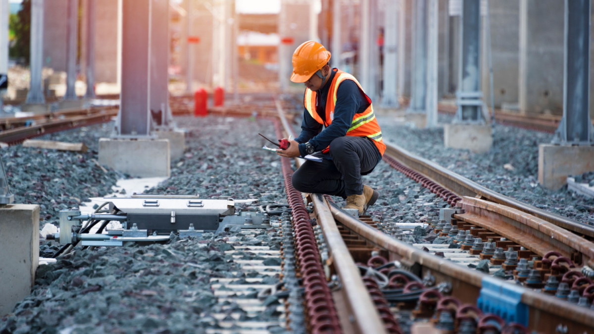 Engineer sitting on railway inspection. construction worker on railways. Engineer work on Railway. Rail, engineer, Infrastructure
