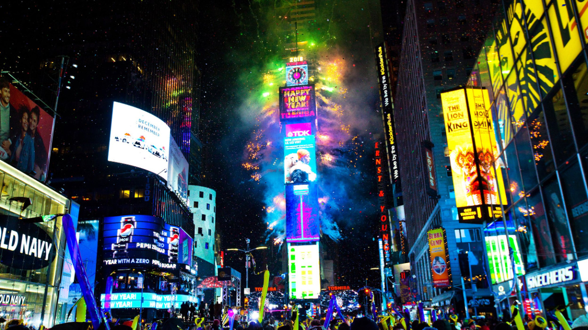 New York City, USA, January 1, 2018, New year's eve celebration on famous times square intersection at midnight with countless happy people enjoying.