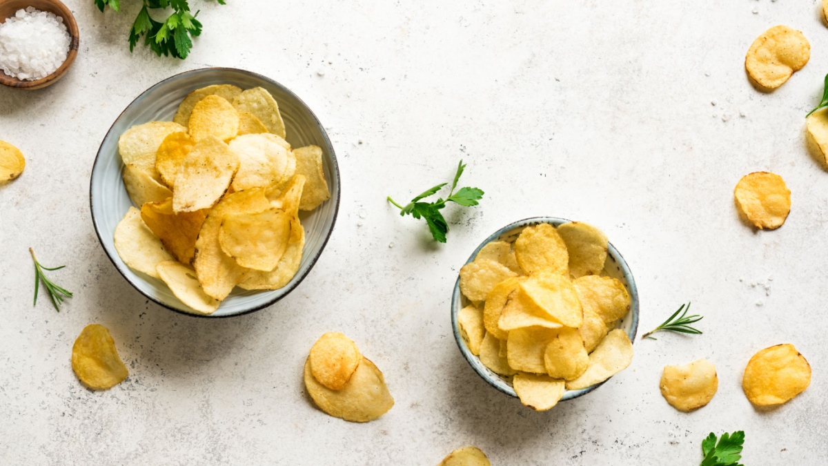 Homemade potato chips in bowls. Oven baked crispy potato chips
