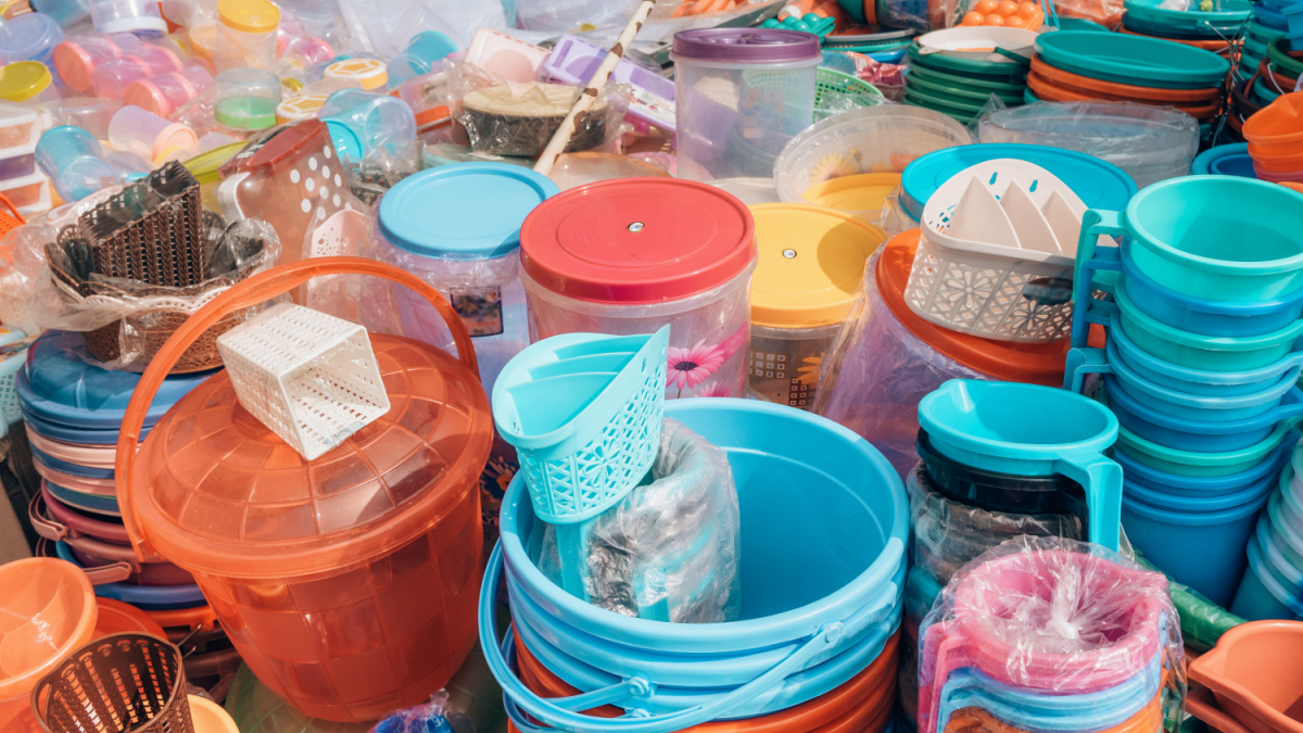 Cheap plastic household items for sale on the market close-up Environment pollution concept