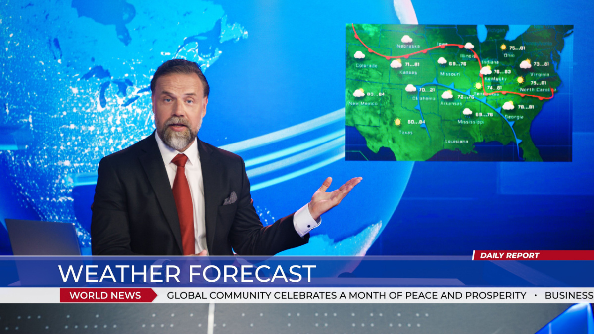 Live News Studio Professional Anchor Reporting on Weather Forecast. Weatherman, Meteorologist, Reporter in Television Channel Newsroom with Video Screen Showing Weather Synoptic Map Chart for U.S.