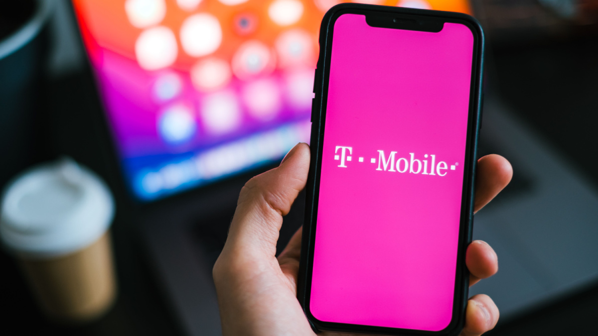 T-mobile logo on the smartphone screen in hand