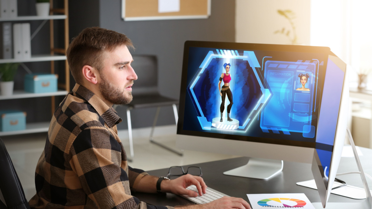Male video games designer working in studio.