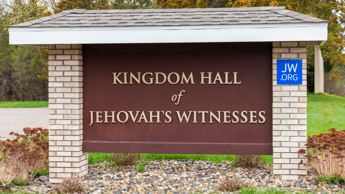 Kingdom Hall of Jehovah's Witnesses exterior sign and trademark logo.