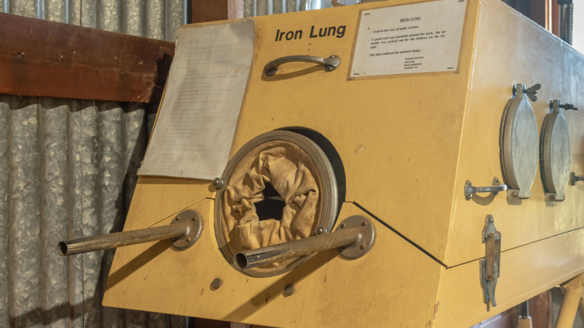 Inverell, Australia - April 14 2021: an iron lung, formerly used to treat victims of the polio epidemic, is on display at the Pioneer Village, a collection of historical buildings and artifacts.