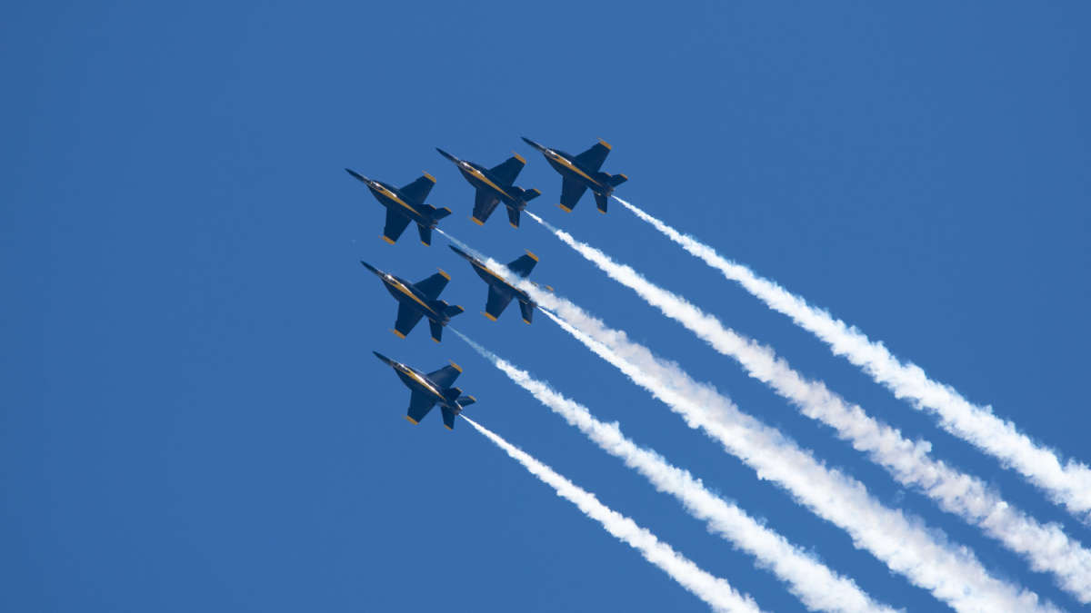A group of flying aircraft against a clear sky during the National Air Show in Cleveland, USA.