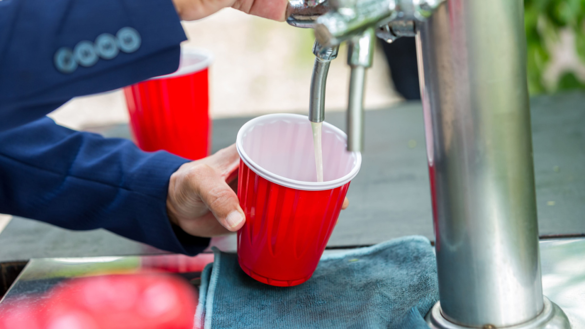 Beer in red cup. Red Plastic Drinking Cups. Plastic red solo drinking cups for beer pong or drinking game.
