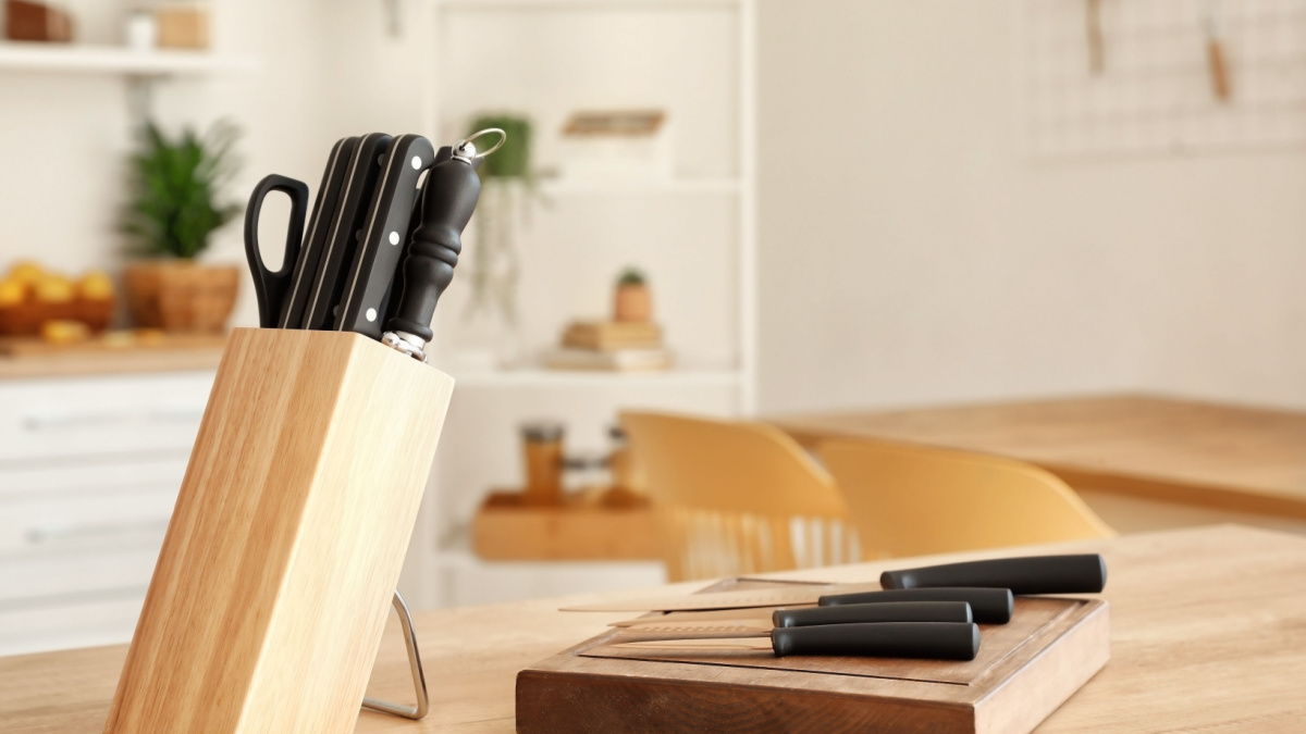 Set of knives on table in kitchen