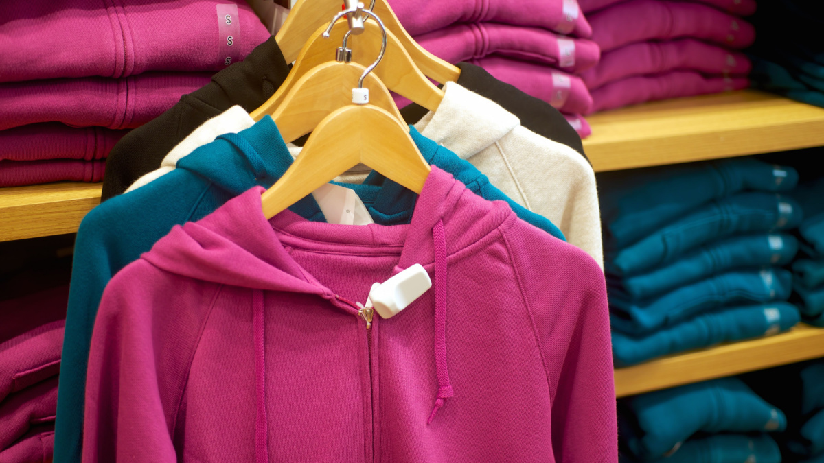 fashion woman's sweats hoodie hanging in trendy boutique.