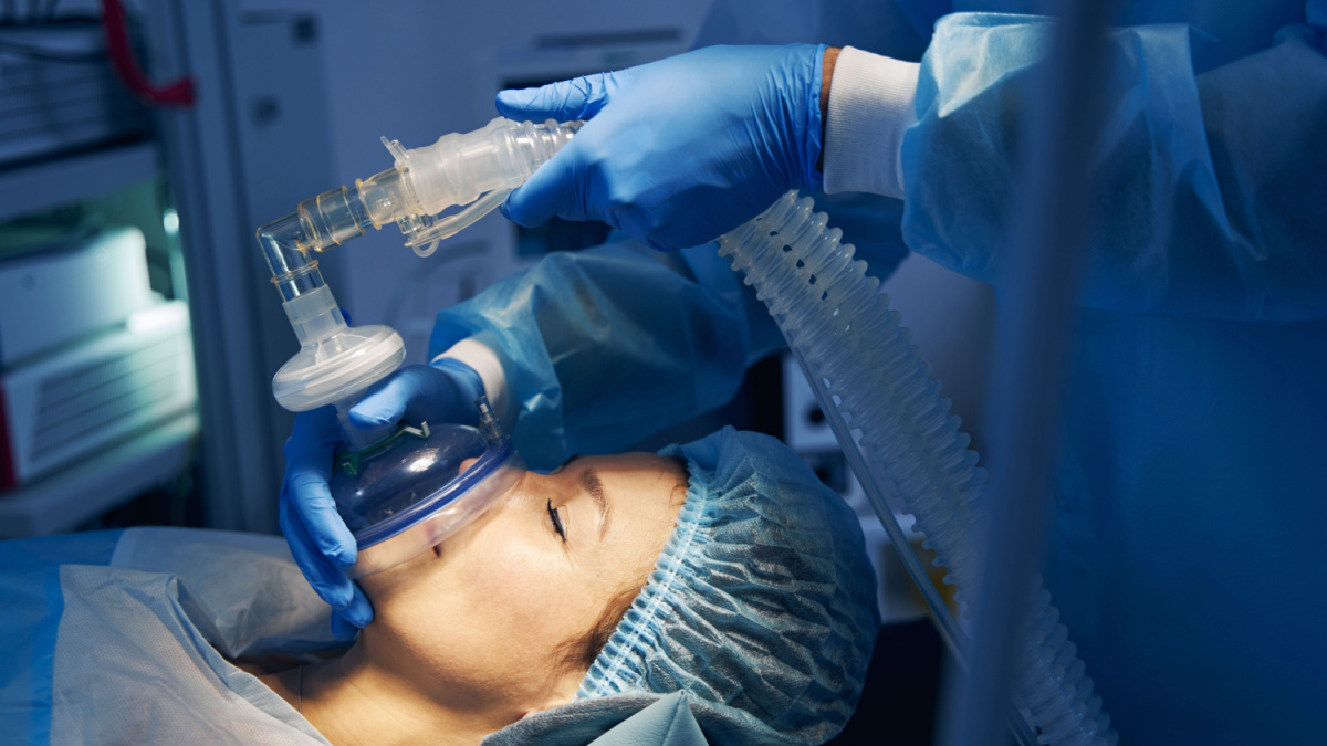 Anesthesia mask placed on the face of female patient