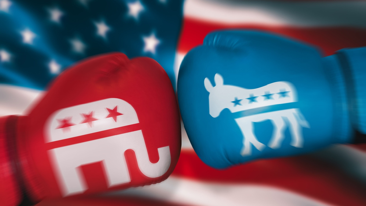 boxing gloves with symbols of USA parties on background of American flag. Concepts of opposition between Republicans and Democrats in congressional elections. motion blur effect. August 24, 2022