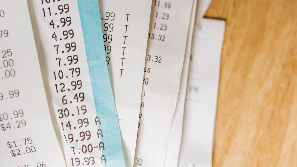 Close-up of receipts from different stores. Accounting, taxes, cost of living.