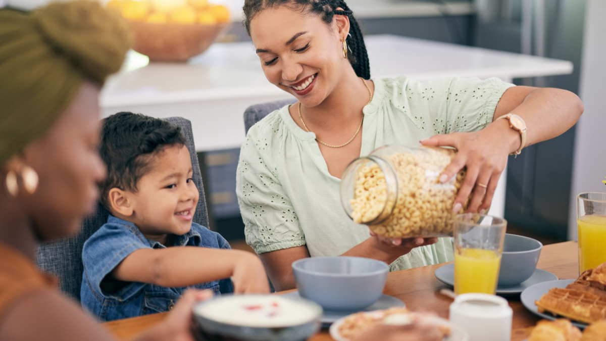 Breakfast cereal, happiness and family eating, giving meal or enjoy quality time together, brunch event and pour morning food.