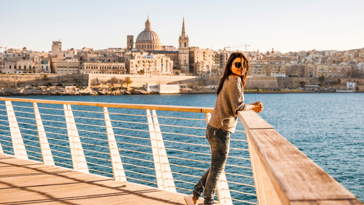 Valletta Malta city Skyline, colorful house balcony Malta Valletta city, young woman visit Malta