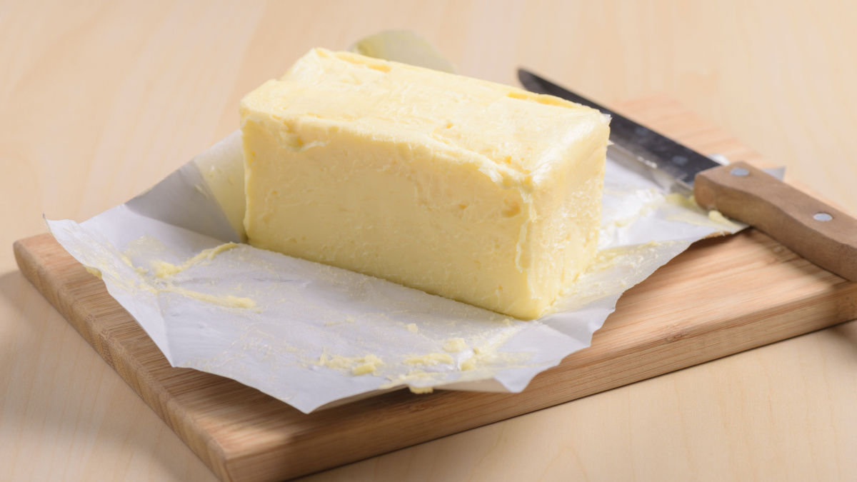 creamy butter in its unwrapped foil paper