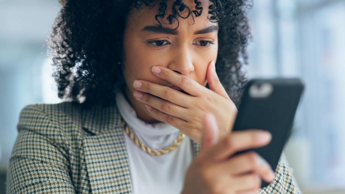 7 Ways To Improve Your Finances With a Social Media Detox 3 Business woman, reading phone and shocked for news, social media post or marketing error in office.