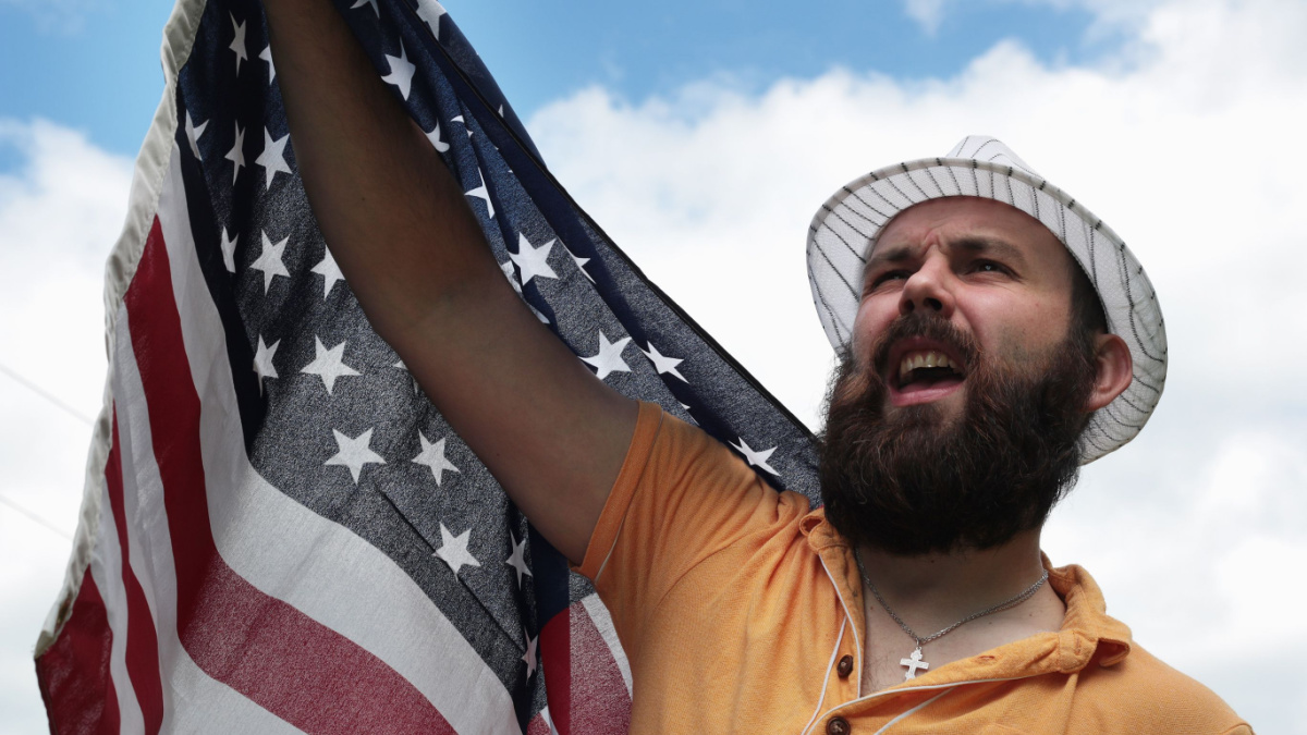 man with a beard with American flag.