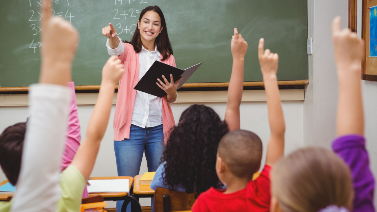 Teacher asking her students a question at the elementary school