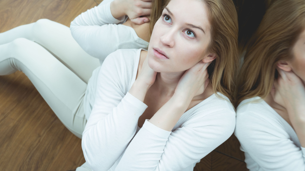 Young pretty scared sick woman with anxiety.