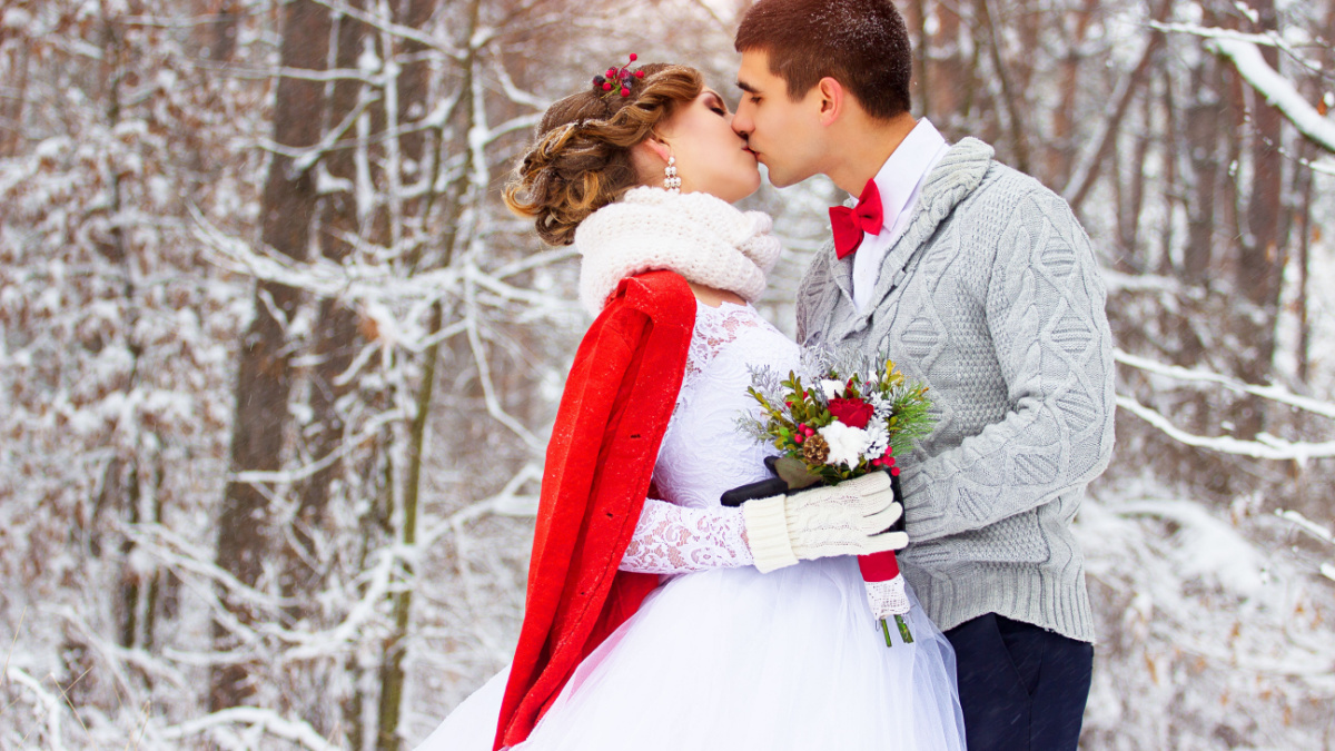 Winter wedding. Beautiful young couple in the woods.