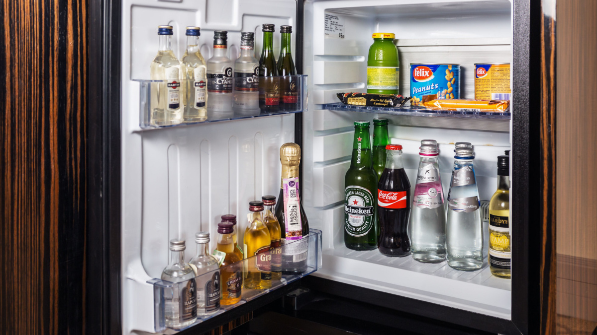 mini bar with soft drinks, vodka, wine and beer in the hotel room at Crown Plaza