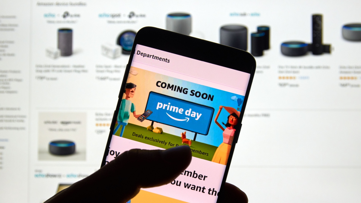 Amazon prime day page and logo on android cell phone over Amazon home page. Amazon Prime Day is the retailer's big members-only summer sale in month of July each year
