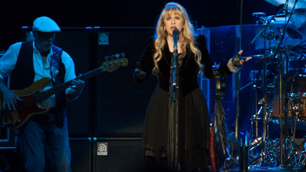 John McVie (L) and Stevie Nicks of Fleetwood Mac perform in support of the bands' Extended Play release at Sleep Train Arena on July 6, 2013 in Sacramento, California.