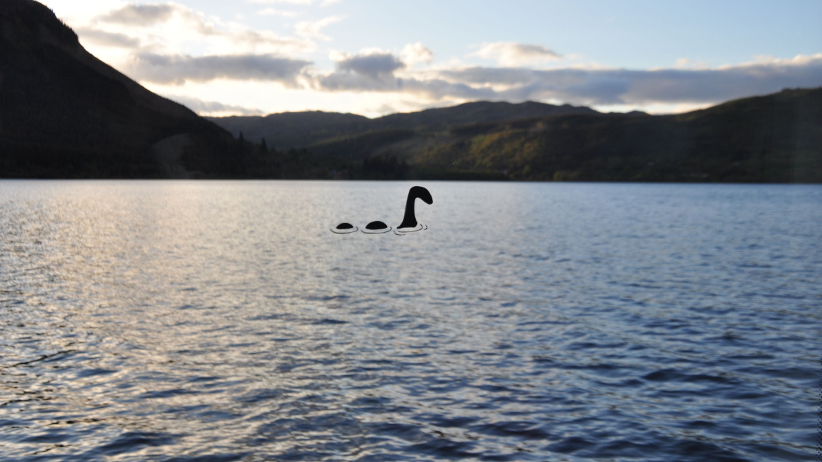 A sticker of Nessie, the Loch Ness monster on the window pane