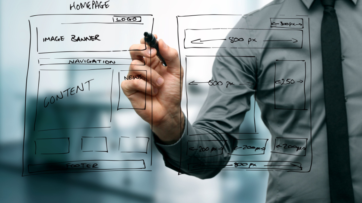 designer drawing website development wireframe