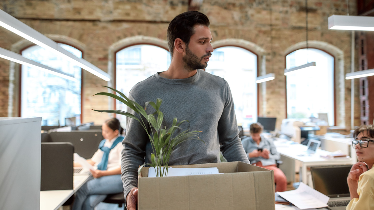 If you don't like your job quit. Upset man in casual wear holding box with things and leaving the office. Quit concept. Office life