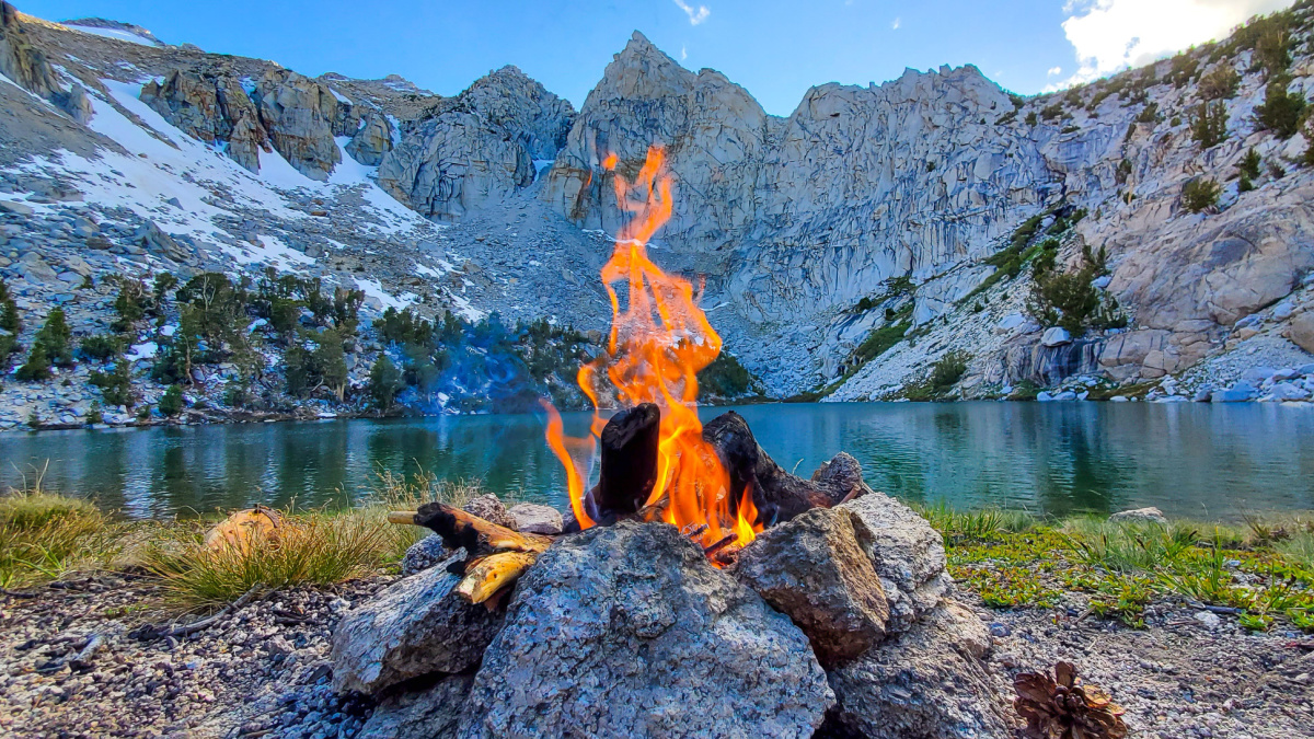 A secluded lake-side campfire after a long day of backpacking through Kearsarge Pass in the John Muir Wilderness.