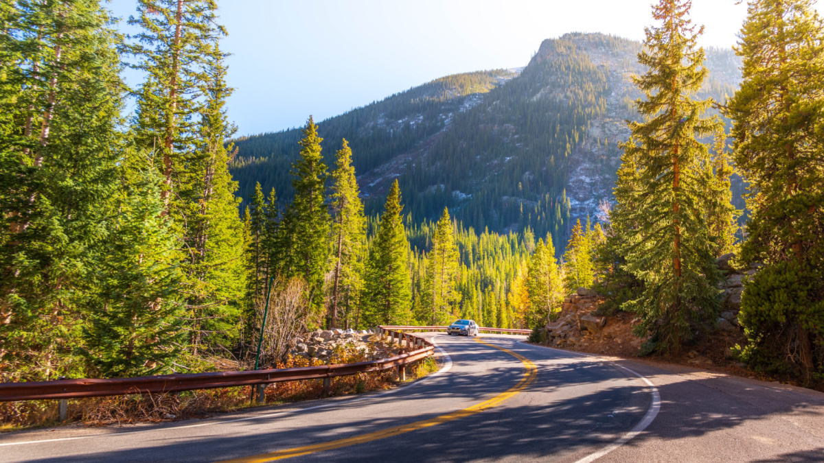 A car traveling along Winding Road Independence Pass Road Route 82, in autumn from Aspen Colorado.