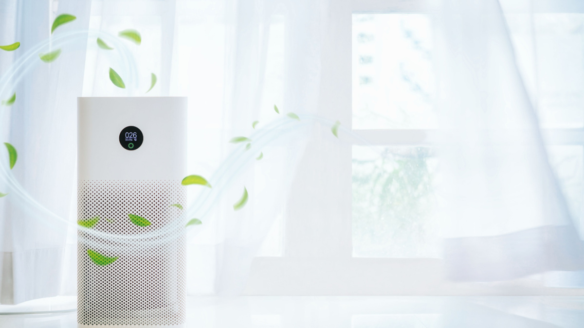 air purifier a living room, air cleaner removing fine dust in house. protect PM 2.5 dust and air pollution concept