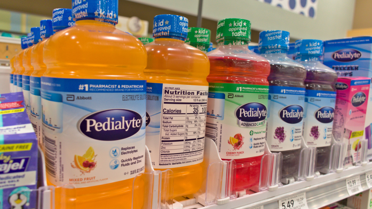 Pedialyte brand of healthy flavored electrolyte medical liquid drink solution for children and hangovers on grocery store shelf