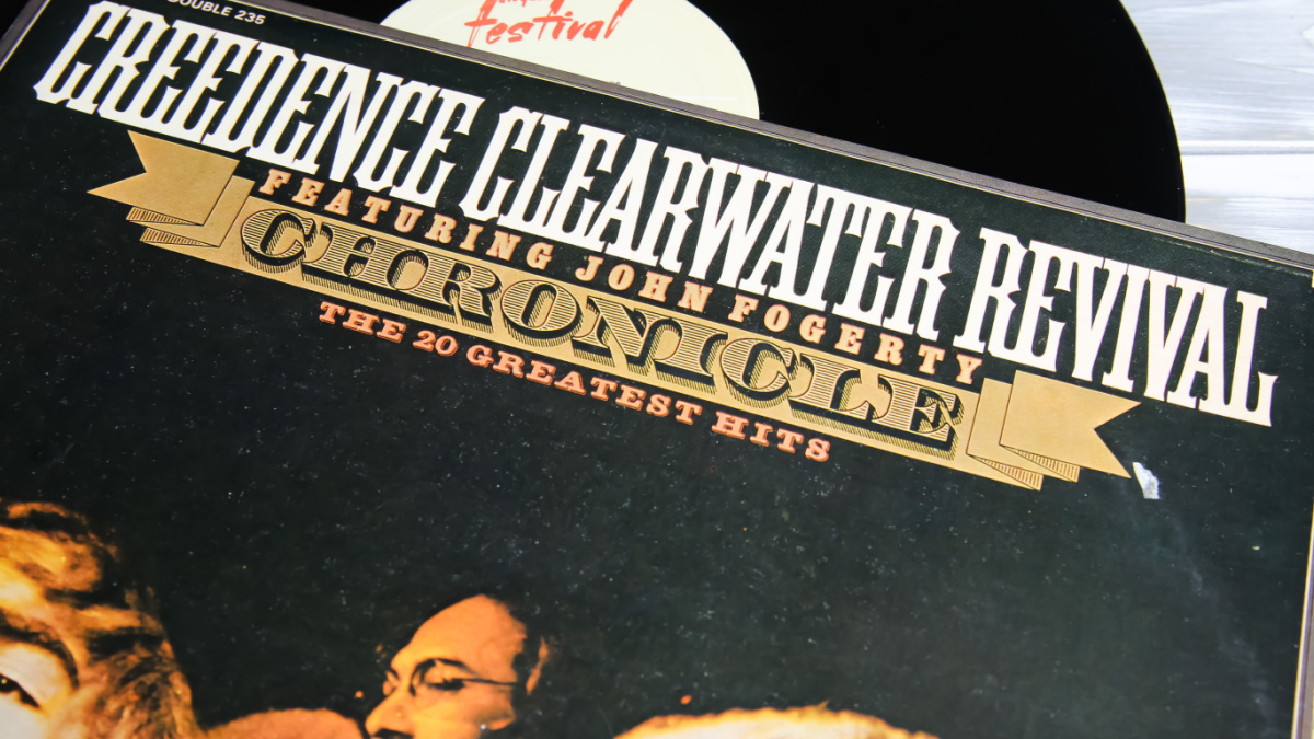 Closeup of creedence clearwater revival band vinyl record cover (focus on center of word chronicle)