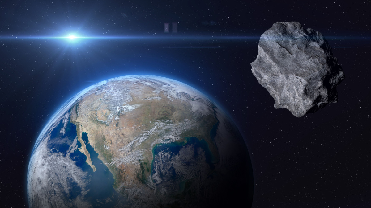 Planet Earth and big asteroid in the space. Potentially hazardous asteroids (PHAs). Asteroid in outer space near Earth planet. Elements of this image furnished by NASA.